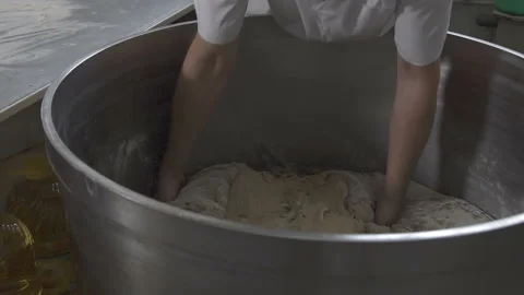 Baker makes bread dough. slow motion Vídeo Stock 100737310