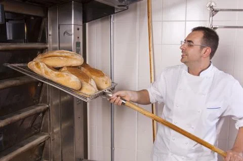 Baker makes the bread Stock Photos