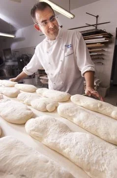Baker makes the bread Stock Photos