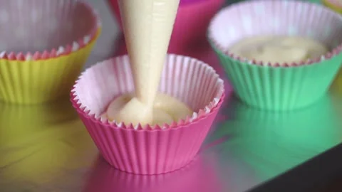Baker makes cupcakes Stock Footage 143584335