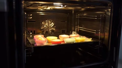 Baker makes cupcakes Stock Footage 143584423