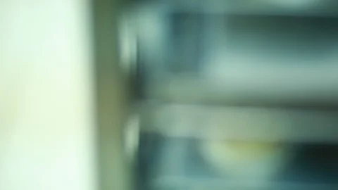 Baker makes deep-dried Sufganiyah for the Jewish festival of Hanukkah. Stock Footage 116412102