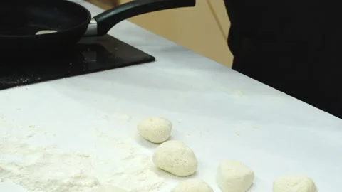 The baker makes dough balls on the table. Stock Footage 171851823