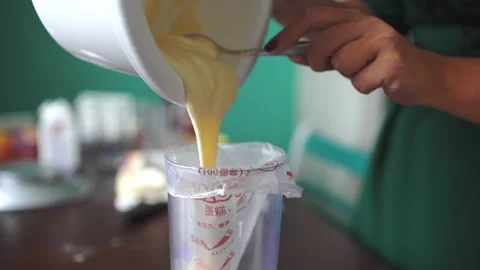 Baker makes the dough making cake Stock Footage 143584850