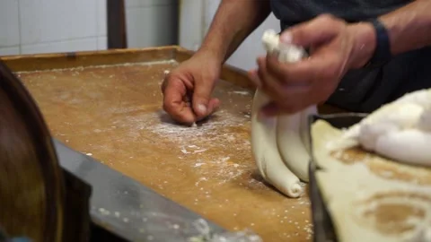 A baker makes Shabbat challahs Stock Footage 246427647