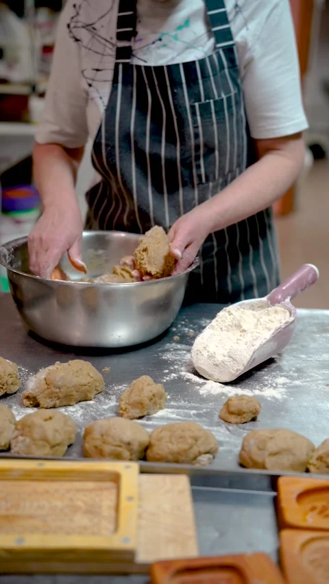 Baker makes sweet cupcakes, baking production Stock Footage 297190344