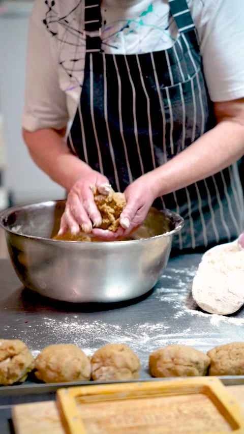 Baker makes sweet cupcakes, baking production Stock Footage 297190357