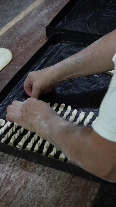 Baker making argentinian croissant Stockbeeldmateriaal 345375601