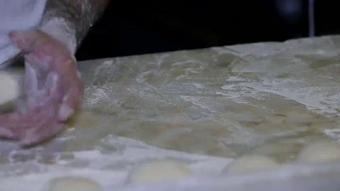 Baker making bread, man hands, kneading dough, cooking coat Stock Footage 69124441