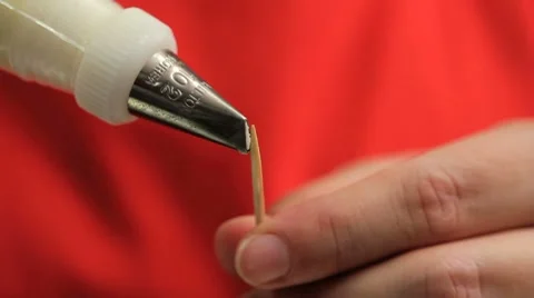 Baker making a flower from icing Stock Footage 8677586