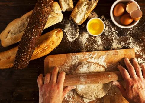 Baker making fresh organic bread for breakfast Stock Photos