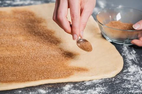 Baker making handmade buns with cinnamon Stock Photos