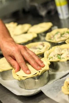 Baker making pies Stock Photos