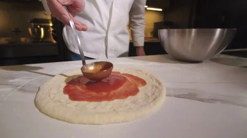 Baker Making Pizza In Restaurant. Chef Cooking Italian Pizza. Cook Prepares Food Vidéo 169877494