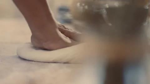 Baker patting out dough for making bread Stock Footage 274681780