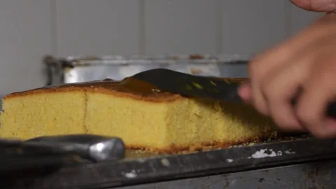 Baker placing syrup on cake Stock Footage 90834054