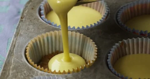 Baker Pouring Cupcake Batter Video stock 201211306