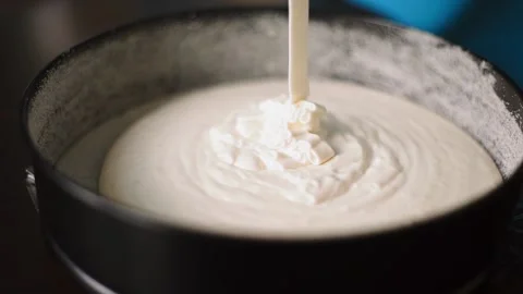 Baker pours batter into the form for baking Video stock 143584833
