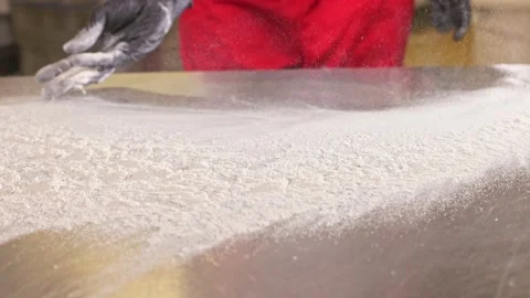 The baker pours flour on the table Stock Footage 155523190