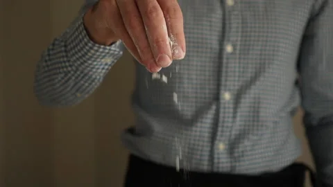 Baker pours flour on the table. Moving Video stock 143257667