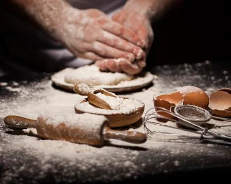 Baker prepares bread. Stock Photos