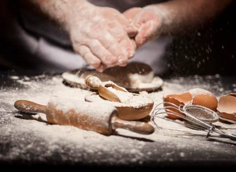 Baker prepares bread. Stock Photos