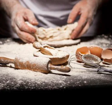 Baker prepares bread. Stock Photos