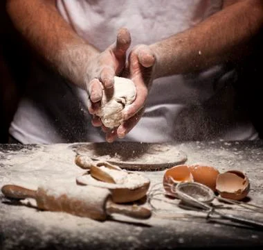 Baker prepares bread. Stock Photos