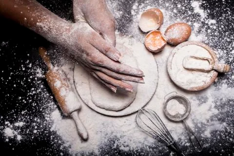 Baker prepares bread. Stock Photos