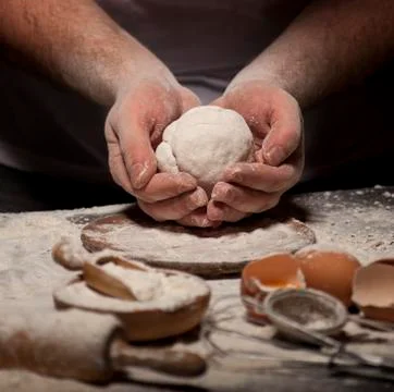 Baker prepares bread. Stock Photos