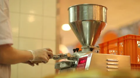 Baker prepares bread rolls with cream Stock Footage 59869792