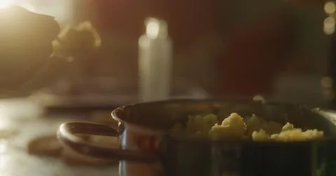 Baker prepares the cake using various ingredients Stock Photos