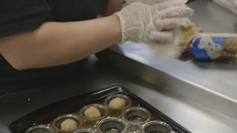 Baker prepares cookies in baking tray Stock Footage 104872443