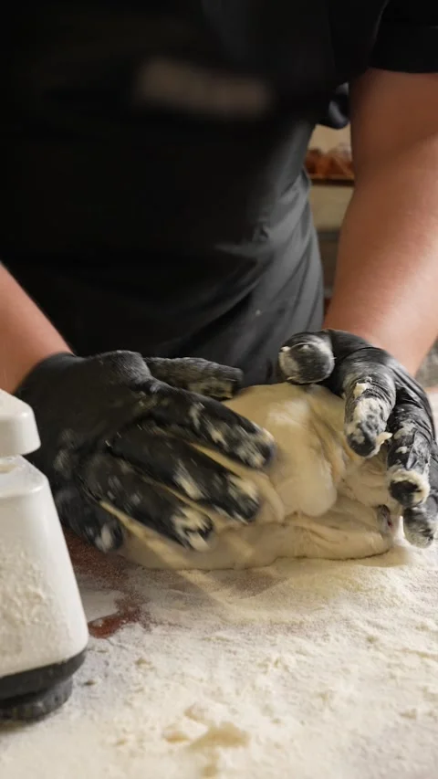 The baker prepares the dough for bread fresh fluffy bread dough Stock Footage 261250401