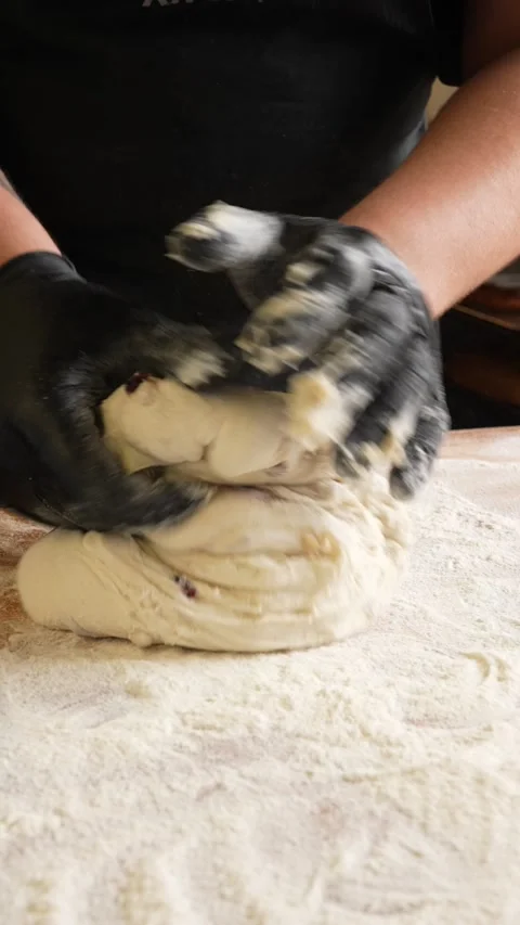 The baker prepares the dough for bread fresh fluffy bread dough Stock Footage 261250403