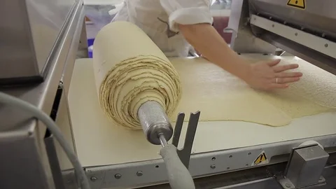 Baker prepares dough in workshop of bakery indoor. Stock Footage 83027465