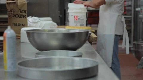 Baker prepares ingredients for a cake Stock Footage 231415135