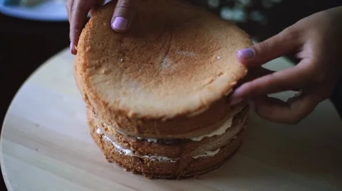 Baker prepares layered sponge cake Stock Footage 65149429
