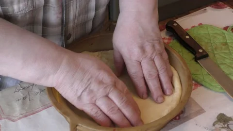 The baker prepares a pie with berries Stock Footage 167105477