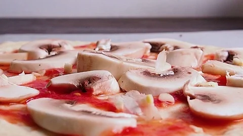 The Baker prepares pizza in the kitchen. Video stock 114751575