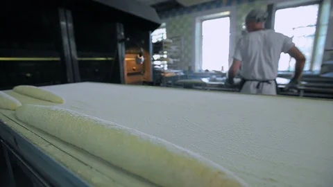 Baker Prepares Raw Bread For Baking Stockbeeldmateriaal 89575705