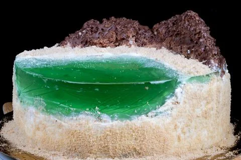 Baker preparing cake sample with visible jelly and crumb texture. Intimate kitch Stock Photos