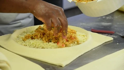 Baker preparing a chicken pot pie in a saucepan Stock Footage 117868944