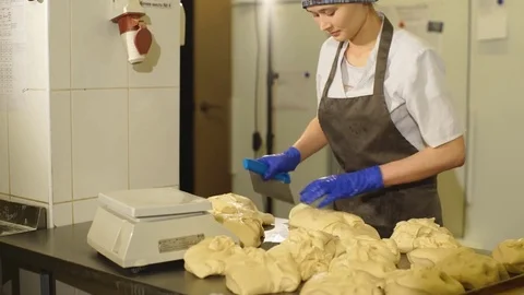 Baker preparing dough for bread Stock Footage 74060134
