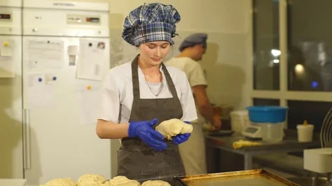 Baker preparing dough for bread Stock Footage 74060682