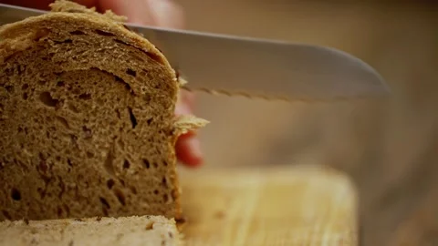 Baker Preparing Freshly Baked Loaf in Rustic Bakery Stock Footage 340483297