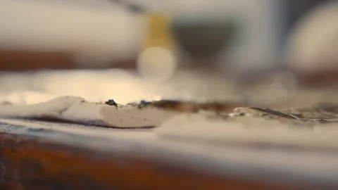 Baker preparing strips of bread with olive oil and zatar on it Stock Footage 274681362