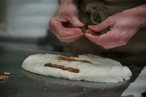 Baker preparing walnut bread Stock Photos