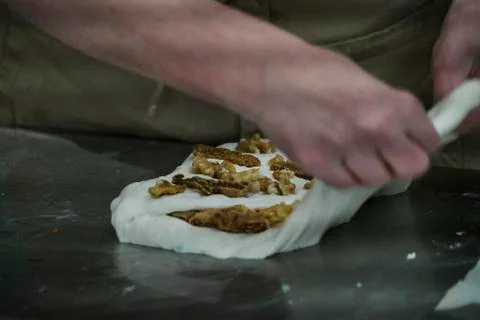 Baker preparing walnut bread Stock Photos