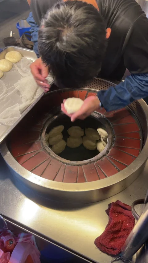 Baker Pressing Pepper Buns Into Charcoal Oven At Taipei Night Market Stall Stock Footage 342828498
